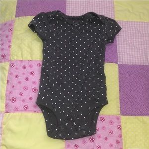 Navy blue onesie and polka dot onesie